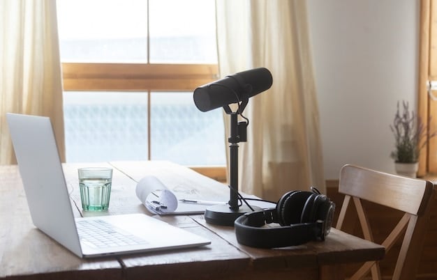 A podcasting setup with a microphone, headphones, and a computer displaying a transcript editing software interface. The workspace is organized, emphasizing the importance of preparing accessible podcast materials.