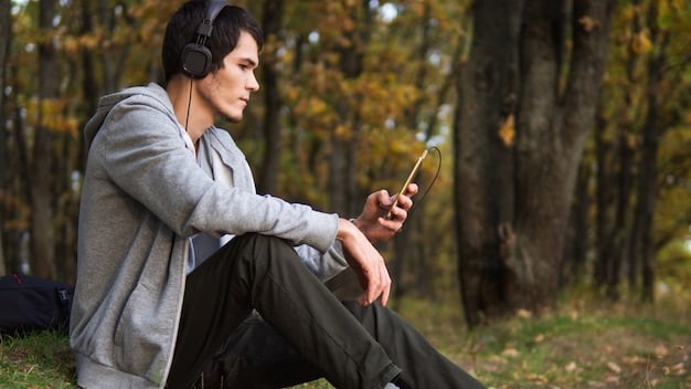 A person attentively listening to a podcast on their smartphone while jogging through a park, illustrating the on-the-go nature of podcast consumption and capturing their engaged expression.