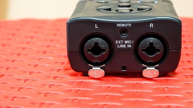 A close-up of a Focusrite Scarlett audio interface, showcasing its XLR inputs, gain knobs, and headphone output. The interface is connected to a computer and a microphone, illustrating its role in a podcasting setup.