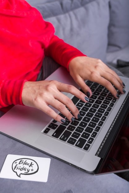 A close-up of a hand typing on a laptop, with a podcast logo visible on the screen, symbolizing professional email outreach and strategic communication.