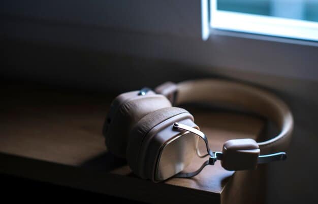 A pair of closed-back headphones, such as the Sony MDR-7506, resting on a desk next to a microphone. The focus is on the headphones, showcasing their design and comfort.