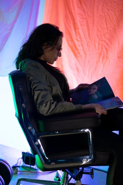 A close-up of a podcast host analyzing a laptop screen showing detailed audience retention graphs, with highlighted drop-off points, in a dimly lit studio environment.