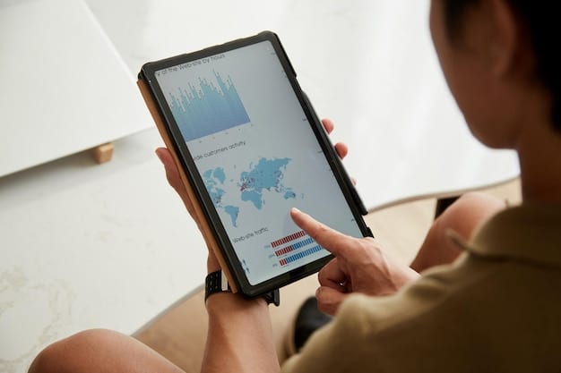 A person's hand pointing at a tablet displaying a clean, professional-looking analytics dashboard for podcast sponsorships, showing metrics like downloads, conversions, and listener engagement. The screen should prominently feature graphs and clear data visualizations.