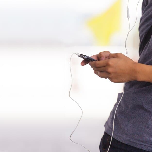 A person scrolling through podcast show notes on a mobile phone, with highlighted keywords.