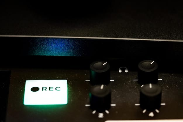 A sleek, modern audio interface with a prominent gain knob and indicator lights, connected to a professional condenser microphone with XLR cables.