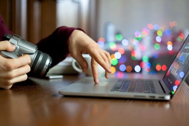 A close-up of a hand typing on a laptop, with a blurred background showing a podcast microphone, symbolizing the precise and thoughtful crafting of outreach emails.