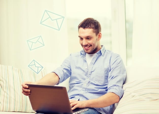 A person confidently typing a compelling pitch email on a laptop, with a podcast logo visible on the screen. The setting is a well-lit home office, emphasizing preparation and digital communication.